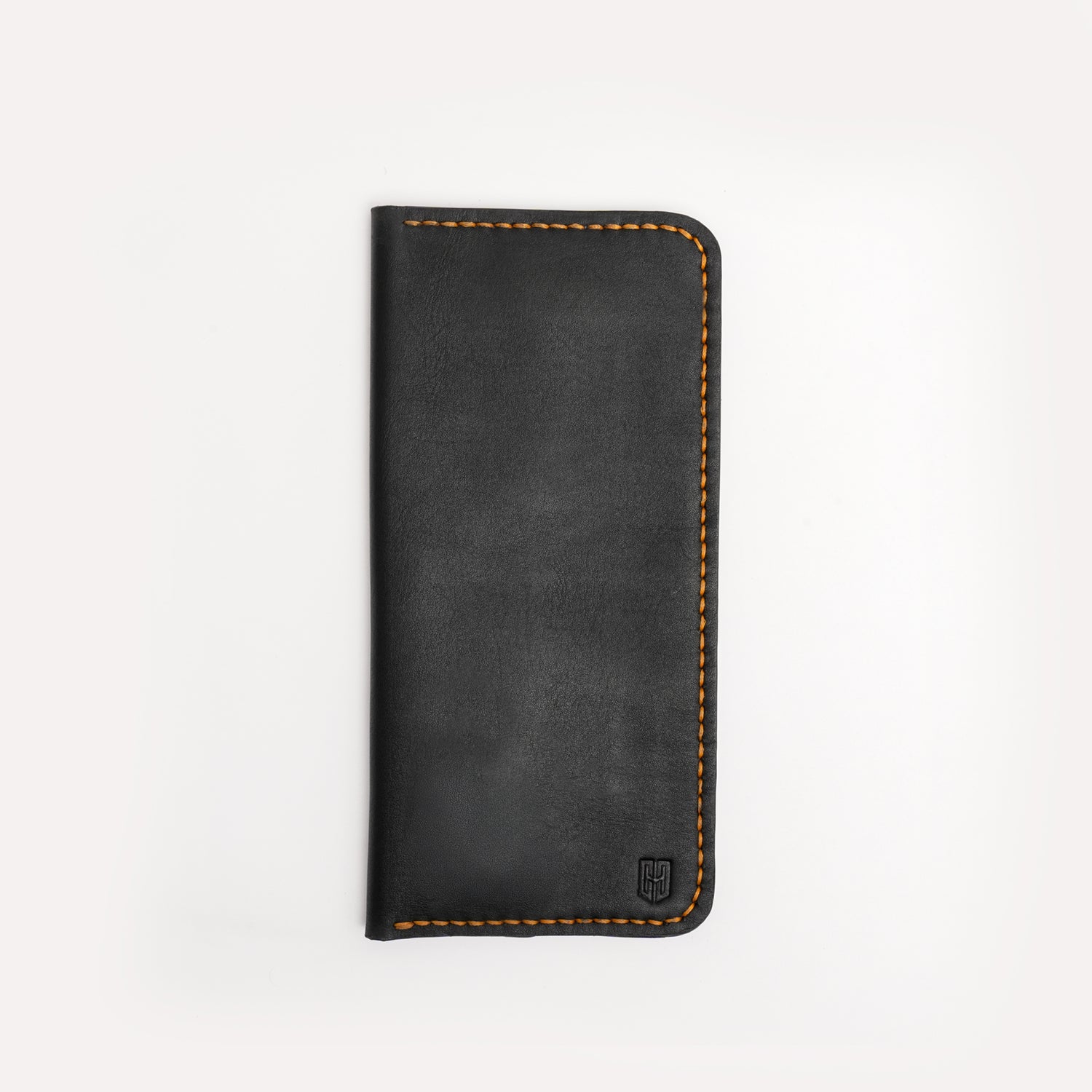Caprahem Travelling Wallet TW-01 in black handmade leather — closed front view with embossed logo